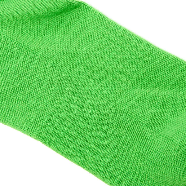 Bright lime green Roka Wembley cotton sock, close-up view highlighting breathable knit fabric and vibrant color.