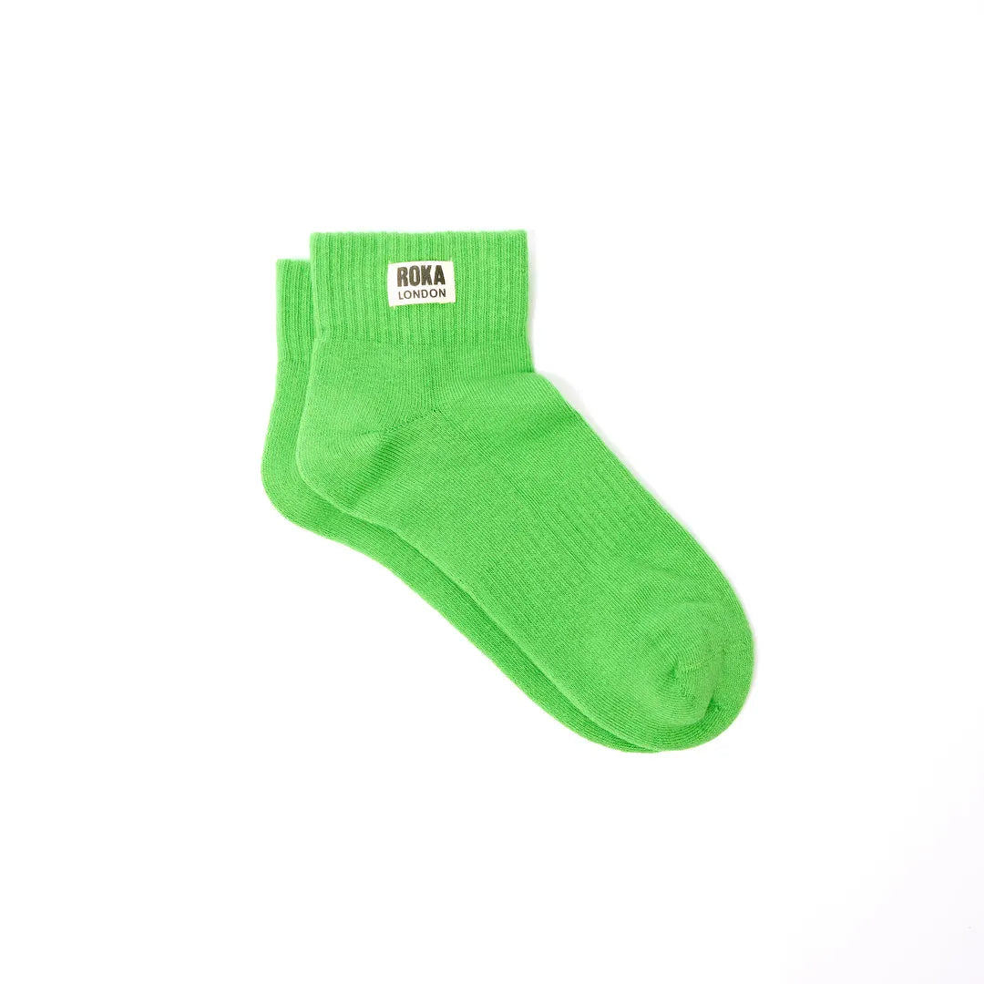 Bright lime green Roka Wembley cotton ankle socks with logo tag, lightweight and comfortable.