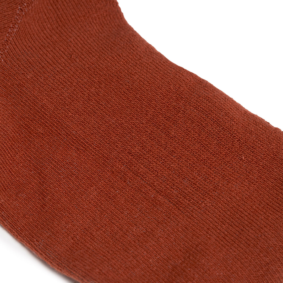 Roka Wembley Ladies Cotton Socks in rust color, close-up of soft, breathable fabric with fine knit texture.