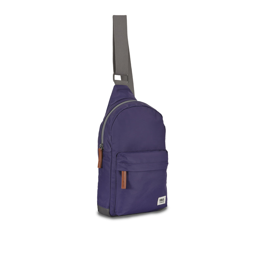 Roka Willesden B Mulberry large recycled nylon sling bag with front pocket, adjustable strap, and tonal zippers.