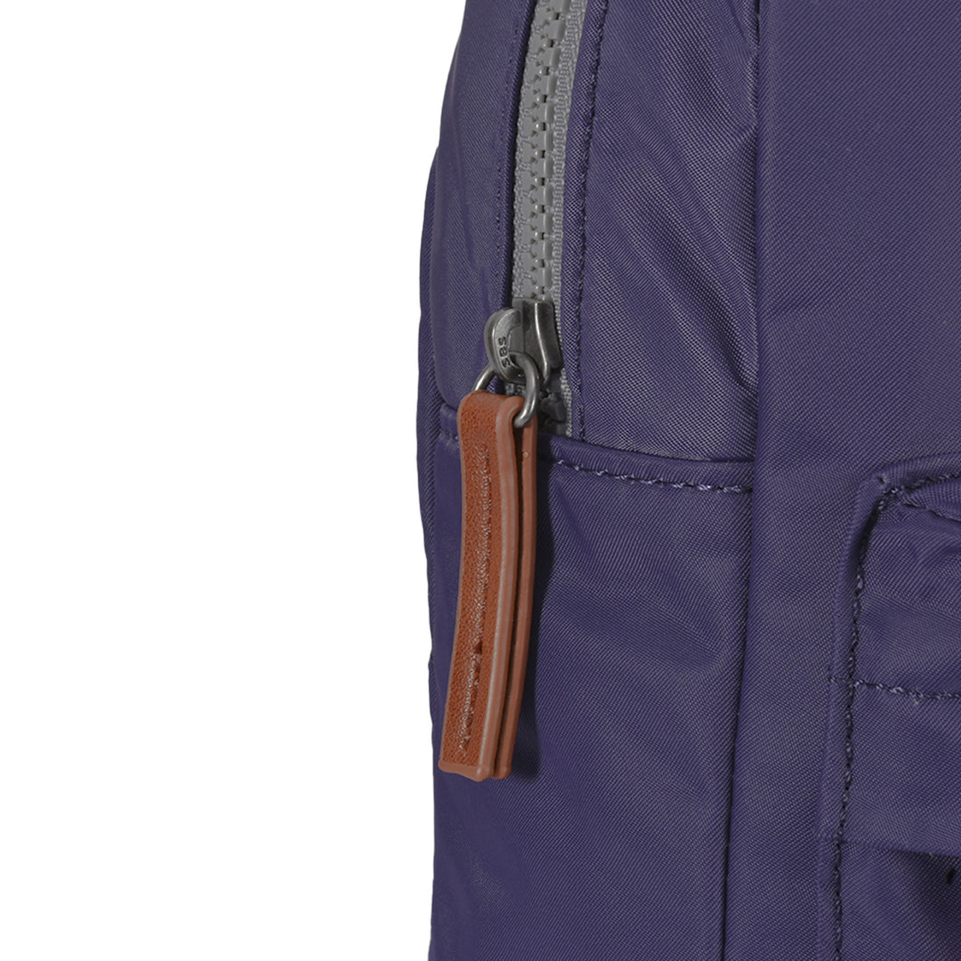 Roka Willesden B Mulberry large recycled nylon backpack with grey zipper and brown leather zipper pull.