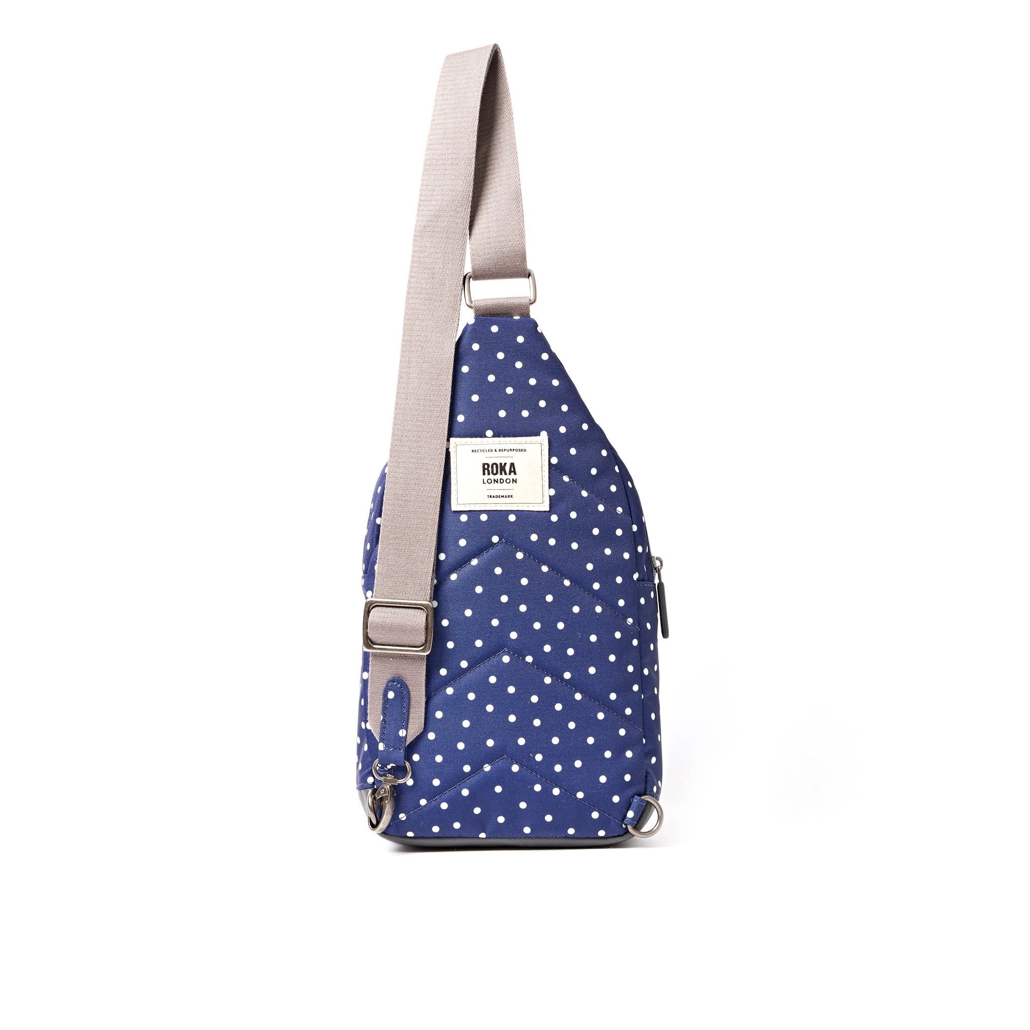 Roka Willesden Navy Polka Dot Recycled Canvas Sling Bag, back view.