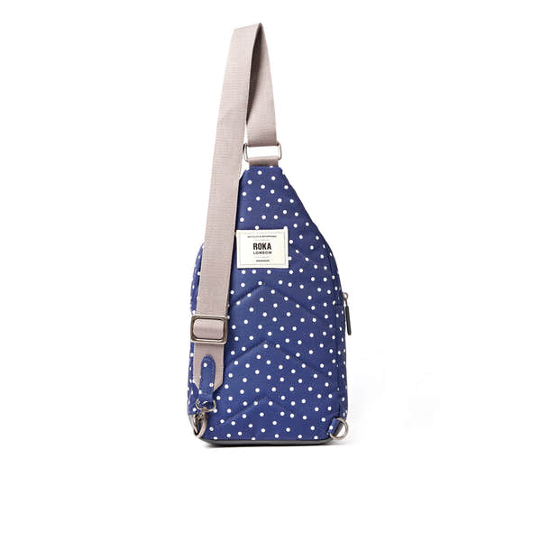 Roka Willesden Navy Polka Dot Recycled Canvas Sling Bag, back view.