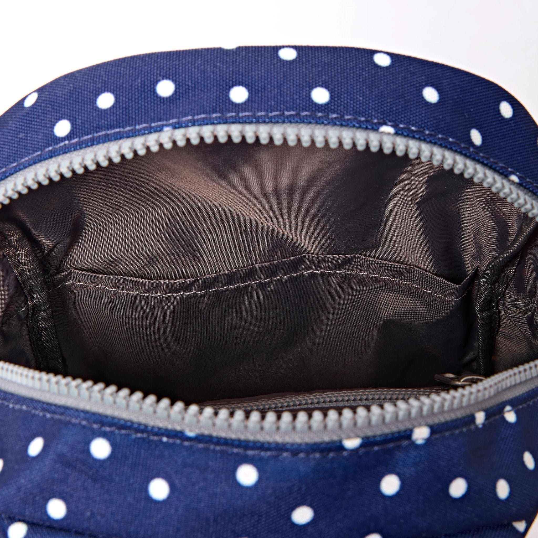 Roka Willesden Navy Polka Dot Recycled Canvas Sling Bag, second interior view.