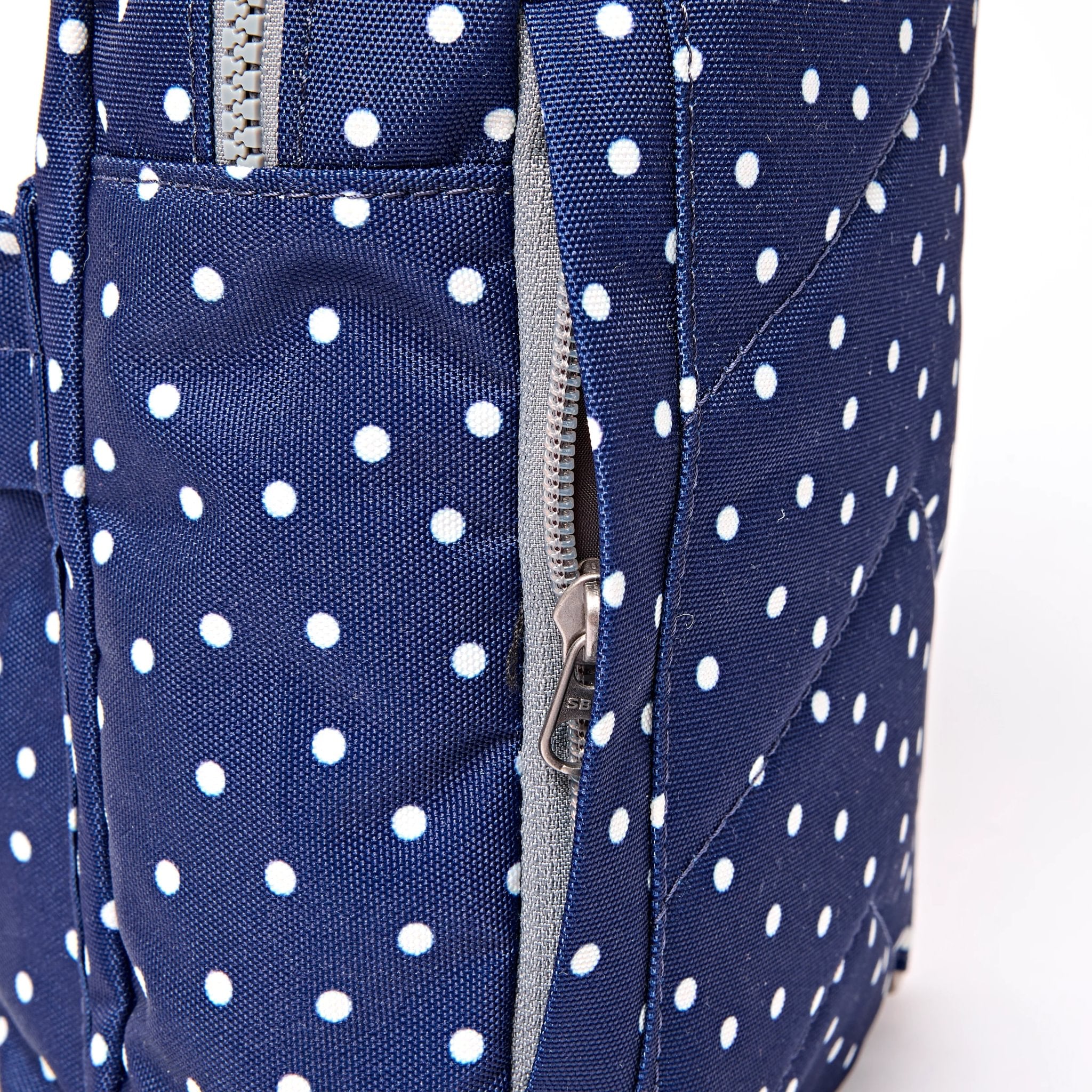 Roka Willesden Navy Polka Dot Recycled Canvas Sling Bag, hardware detail.