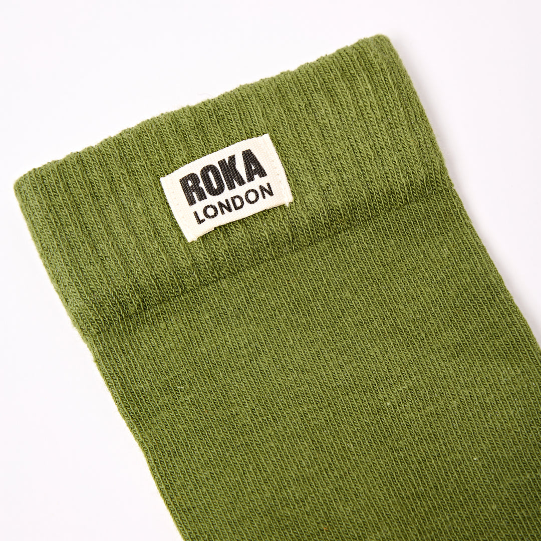 Roka Wimbledon Ladies Cotton Crew Sock in olive green with a white label, one size, avocado color, comfortable and casual footwear accessory.