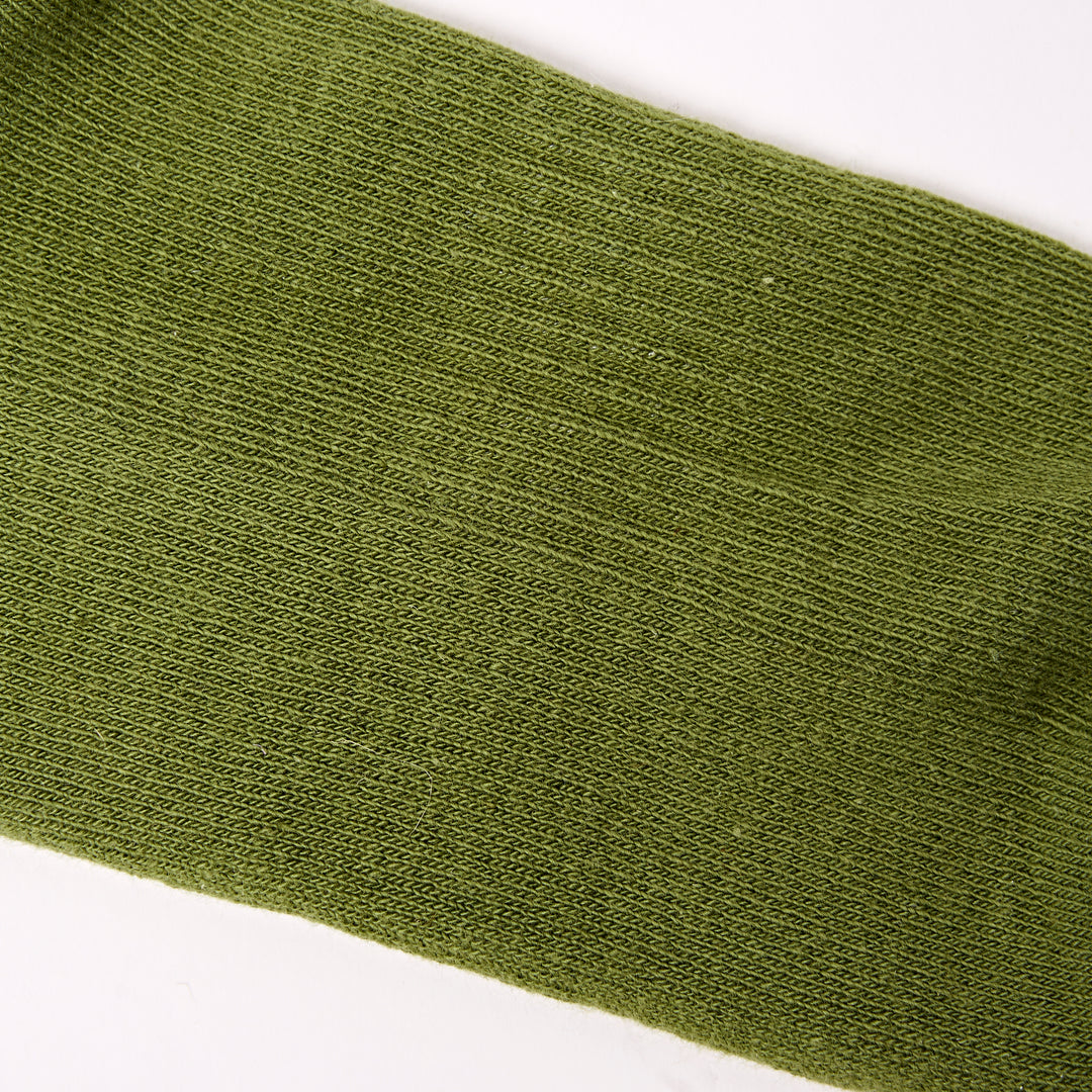 Roka Wimbledon women's cotton crew sock in avocado green, one size, close-up image highlighting fabric texture and color.