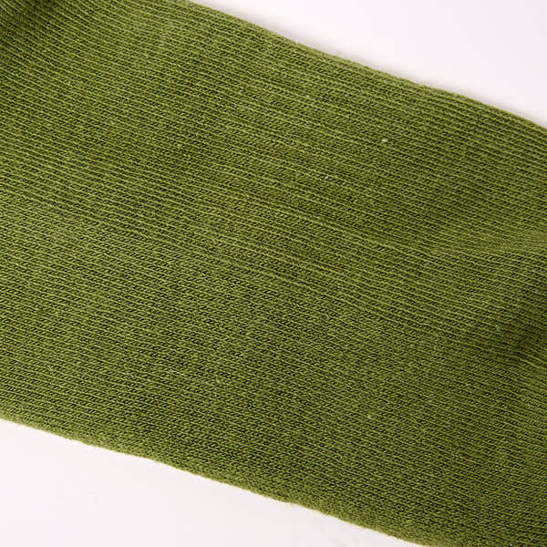 Roka Wimbledon women's cotton crew sock in avocado green, one size, close-up image highlighting fabric texture and color.
