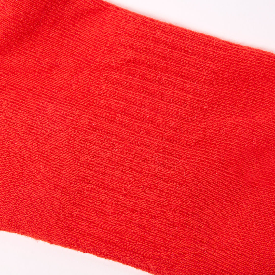 Roka Wimbledon women's cotton crew sock in cranberry color, one size, with a close-up view of the textured fabric and ribbed design.