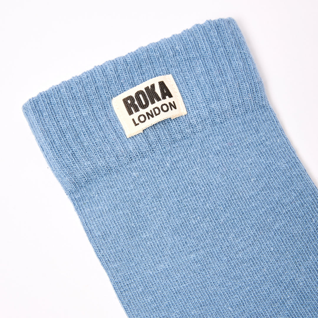 Roka London men's cotton crew sock in Airforce blue, one size, athletic style with ROKA branding, soft texture, and breathable fabric.