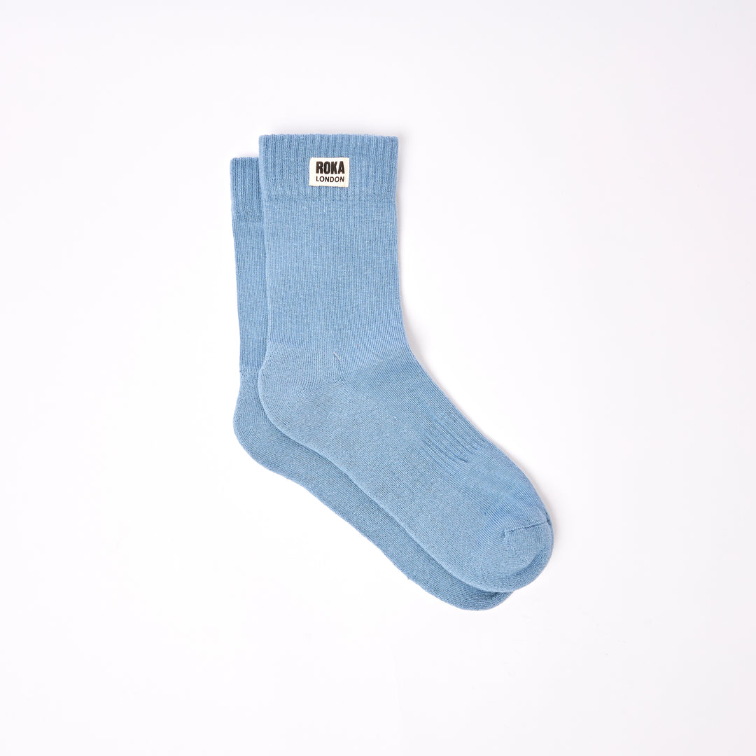 Roka Wimbledon men's cotton crew sock in Airforce blue, one size, with Roka London label, lightweight and comfortable for casual wear.