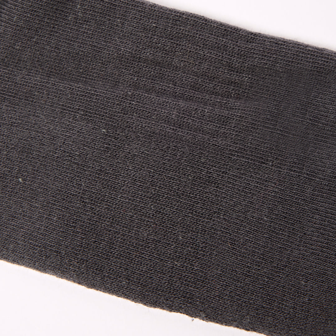 Roka Wimbledon men's cotton crew sock in faded black, one size, close-up of fabric texture and subtle branding details.