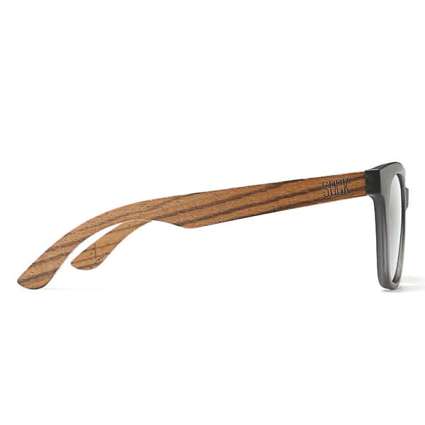 SOEK Lila Grace sunglasses with charcoal gray gradient lenses, black frame, and walnut wood arms.