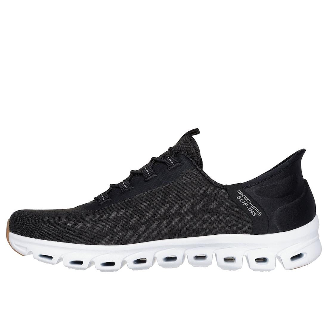 Skechers Glide Step Tranquility women's slip-on trainers in black and white with textured textile upper and cushioned outsole.