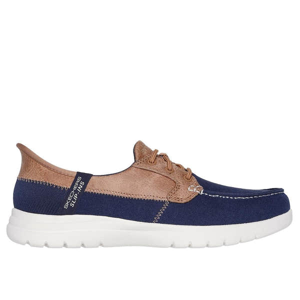 Skechers On-The-Go Flex Palmilla Ladies Navy Slip-On Shoes with mixed fabric upper and cushioned white sole.