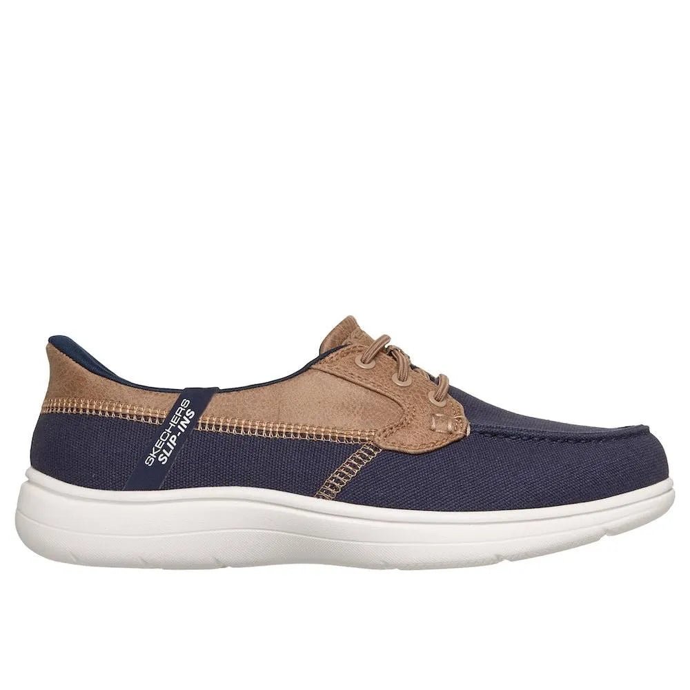 Skechers Ladies On-The-Go Flex Radiant Navy Vegan Canvas Slip-On Boat Shoe with white sole and beige accents.