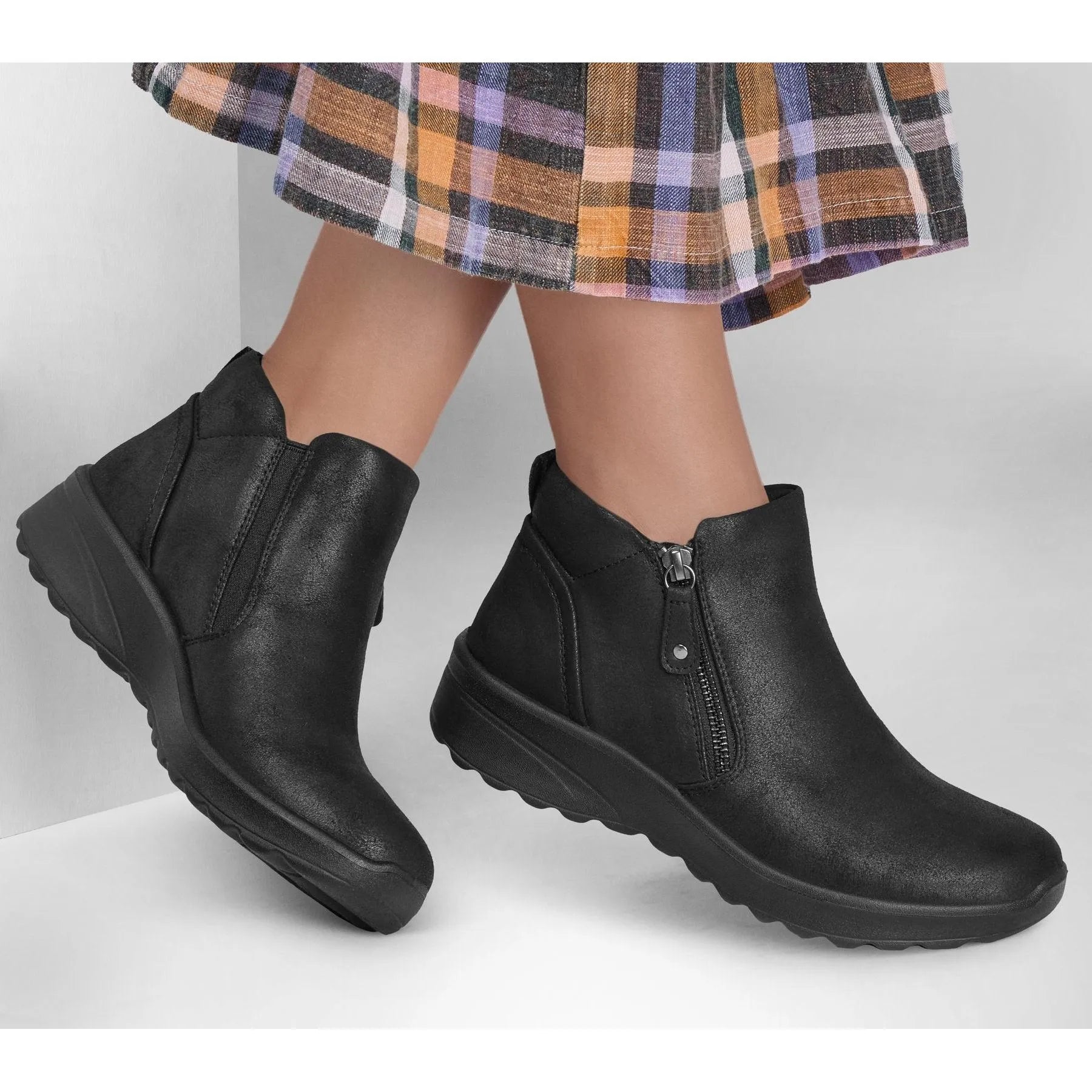 Skechers Lovely Vibe fall ankle boots for women, black vegan leather, side zipper, wedge sole, stylish and comfortable.