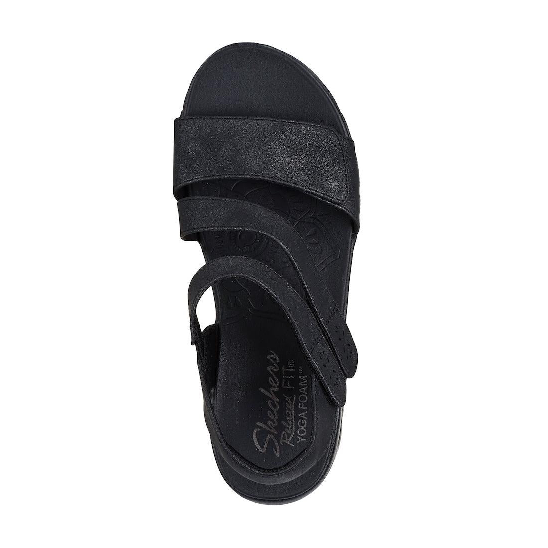 Skechers women's black vegan slip-on sandals with touch-fastening straps, designed for all-day comfort and casual wear.