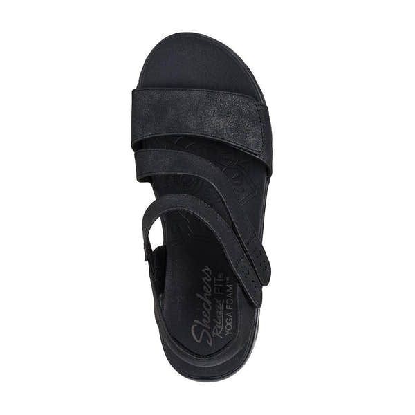 Skechers women's black vegan slip-on sandals with touch-fastening straps, designed for all-day comfort and casual wear.