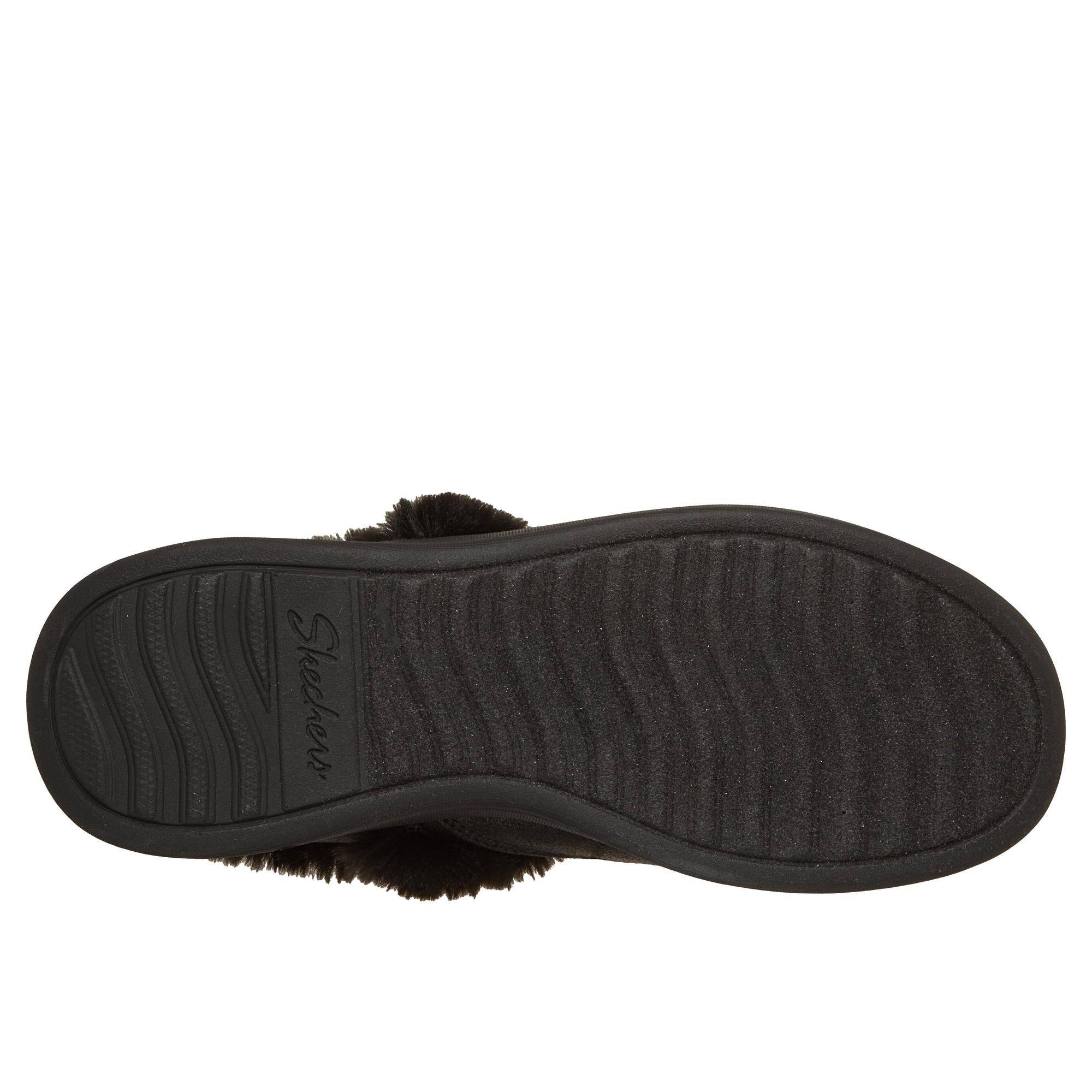 Black Skechers Cozy Escape vegan slip-in slippers with water-resistant faux leather and cushioned sole.