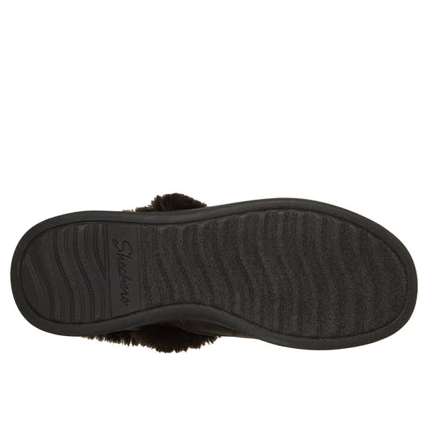 Black Skechers Cozy Escape vegan slip-in slippers with water-resistant faux leather and cushioned sole.