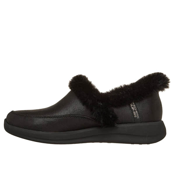 Skechers Cozy Escape slip-on slippers for women, black vegan leather, water-resistant with plush faux fur trim and flexible sole.
