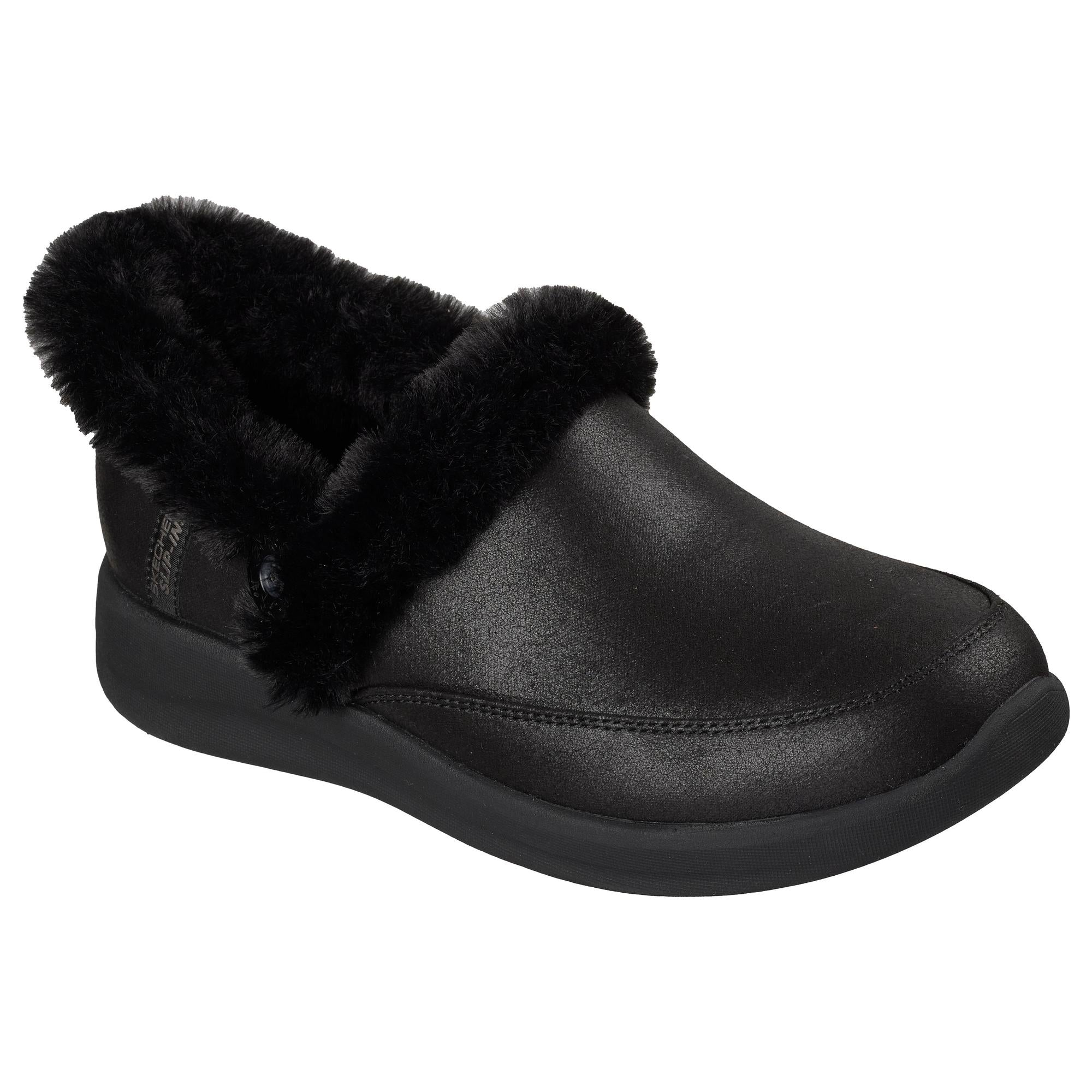 Skechers Cozy Escape slip-on women's black vegan leather slippers with water-resistant exterior and plush faux fur lining.