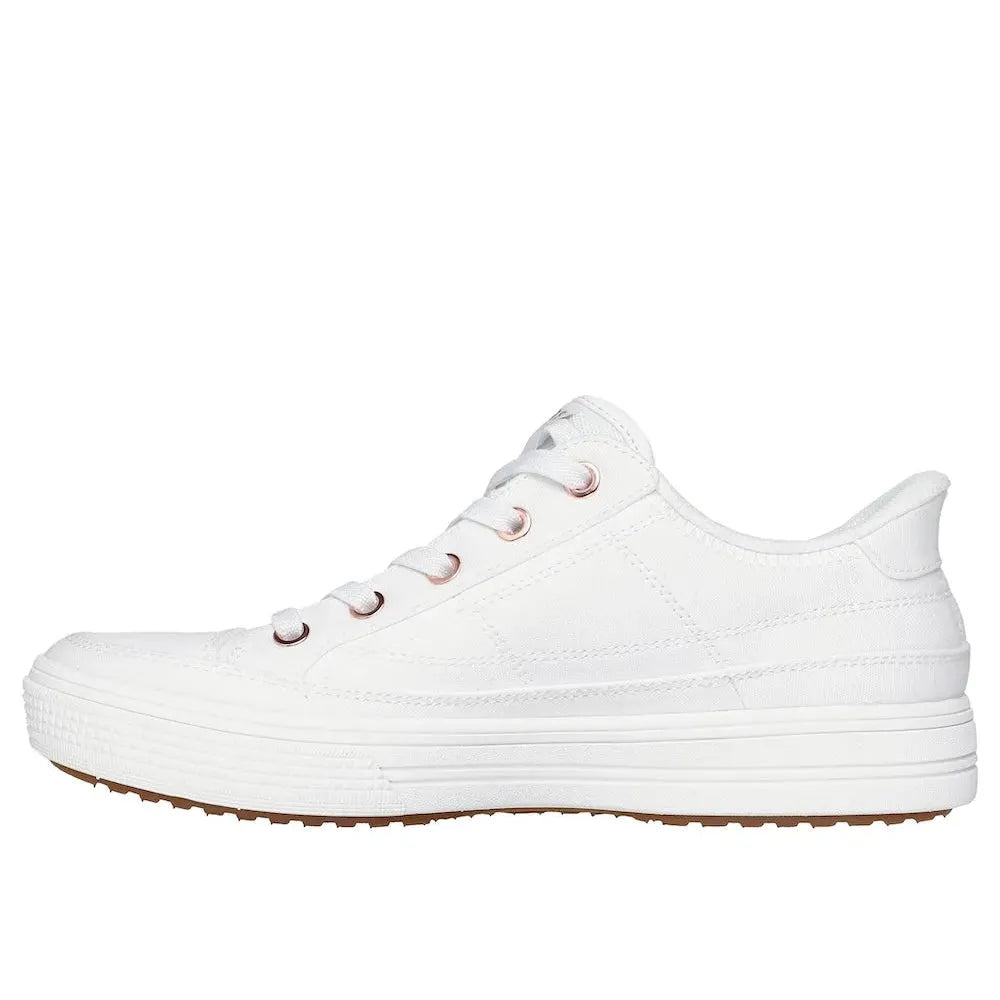 Skechers Arch Fit Arcade Ladies White Vegan Textile Slip-On Trainers with arch support and sporty design.