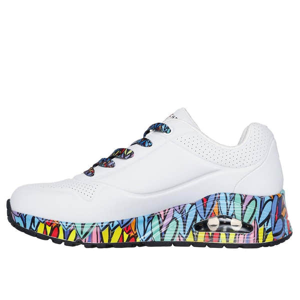 Skechers Uno Ravaged Love ladies' white and multi-color lace-up trainers with a graffiti-inspired pattern on the sole.