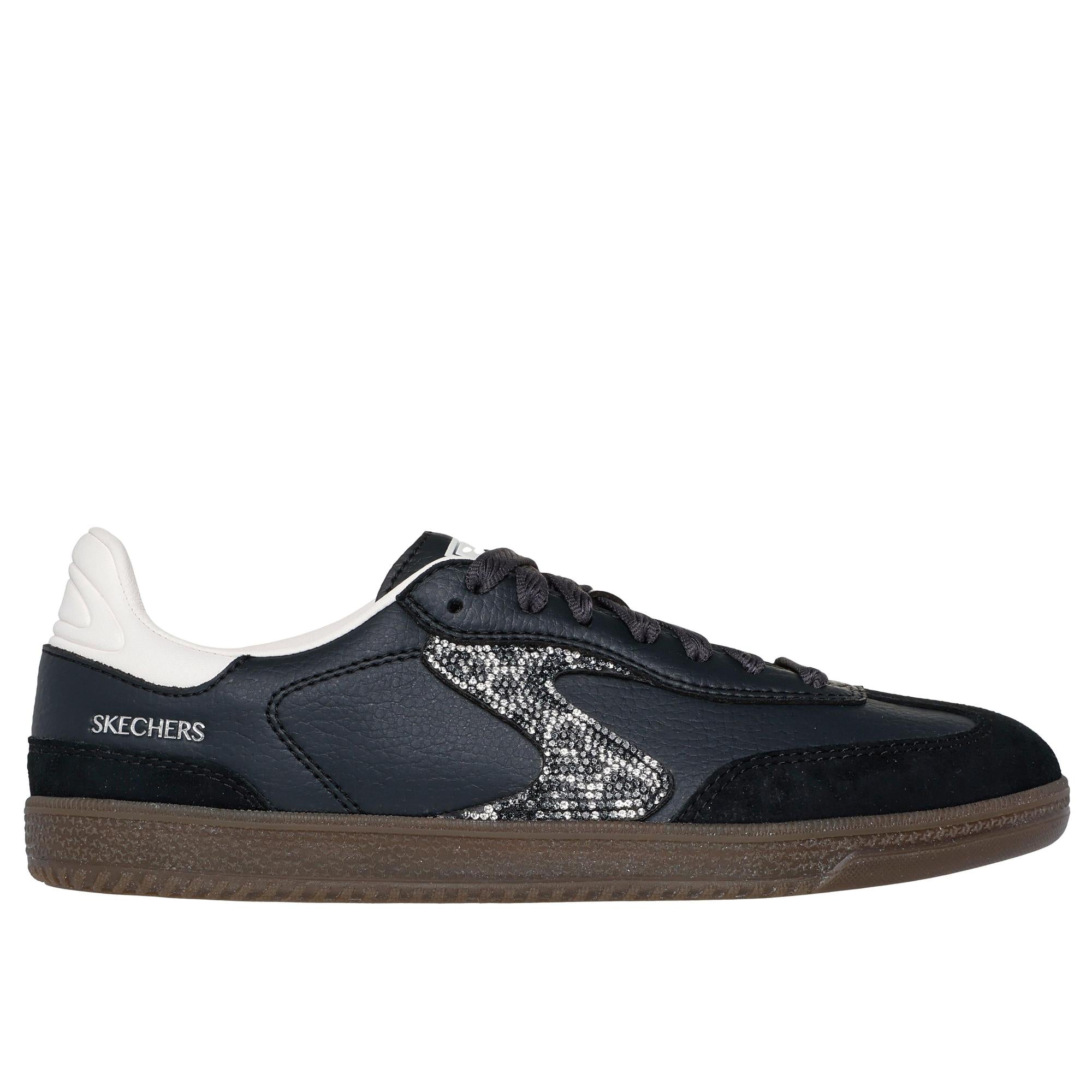 Skechers Hotshot women's slip-on trainers in black and white leather with shimmering spots and brown sole.