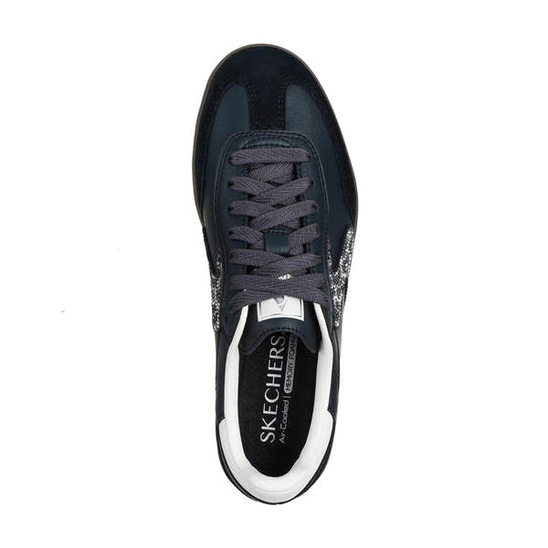 Skechers Hotshot ladies' slip-on trainers in black and white with shimmering spots, leather and textile upper, cushioned memory foam insole.
