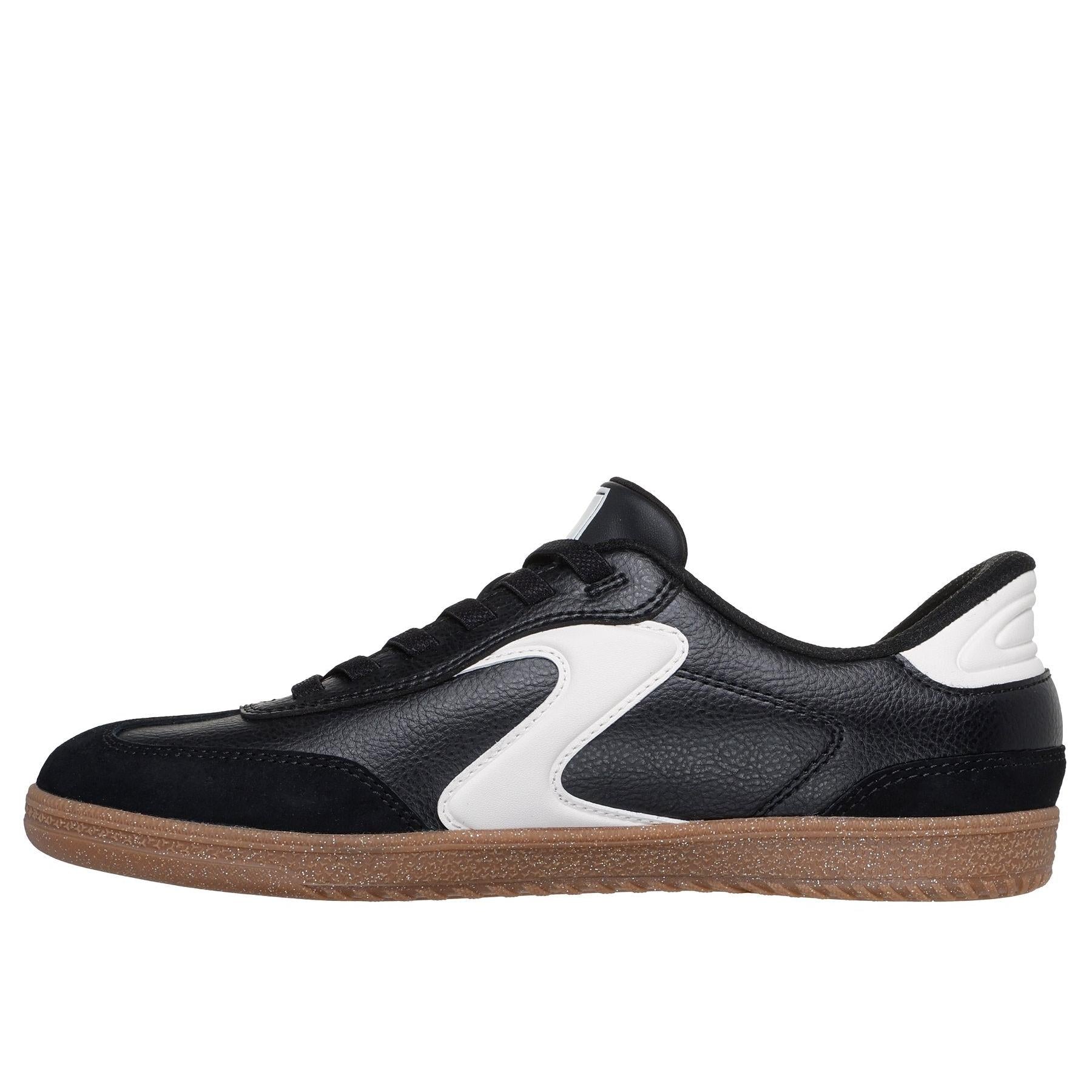 Skechers Hotshot women's black and white slip-on trainers with leather and textile upper, cushioned sole, and gum rubber outsole.