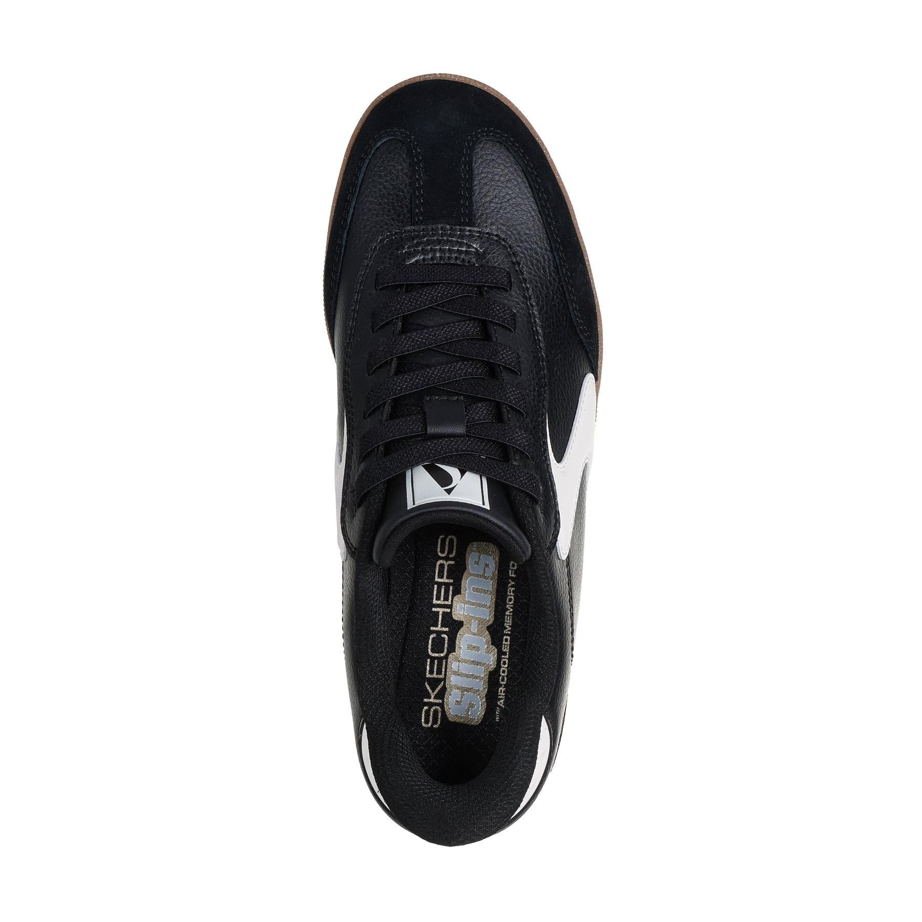 Skechers Hotshot ladies' black and white slip-on trainers with leather and textile upper, cushioned insole, and sporty design.