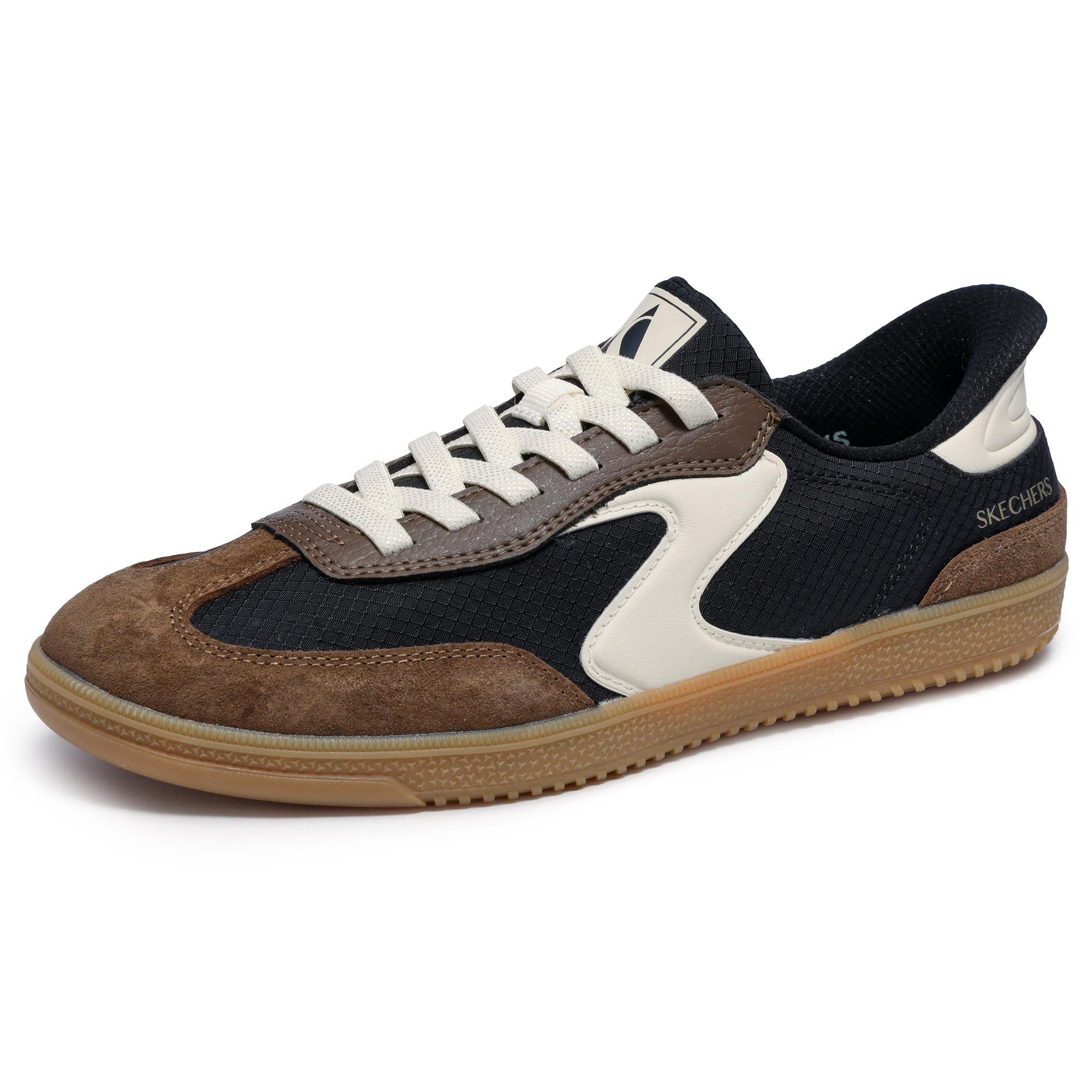 Skechers ladies slip-on trainers with black, brown leather, and textile upper, beige accents, and rubber sole.