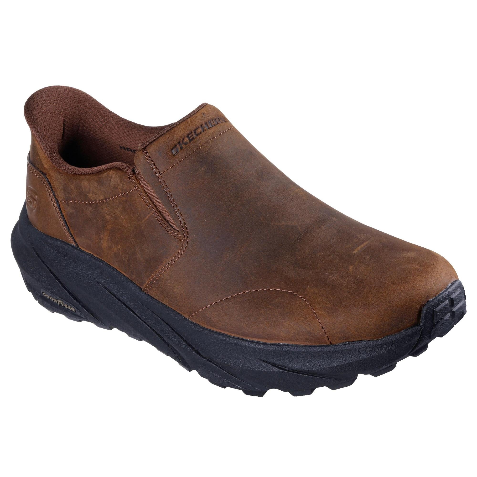 Skechers 205547 men's dark brown leather slip-in trainers with black rubber sole and cushioned interior.
