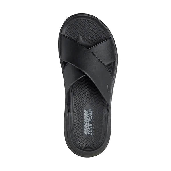 Skechers men's black leather slip-on sandals with cushioned insole and textured outsole for comfort.