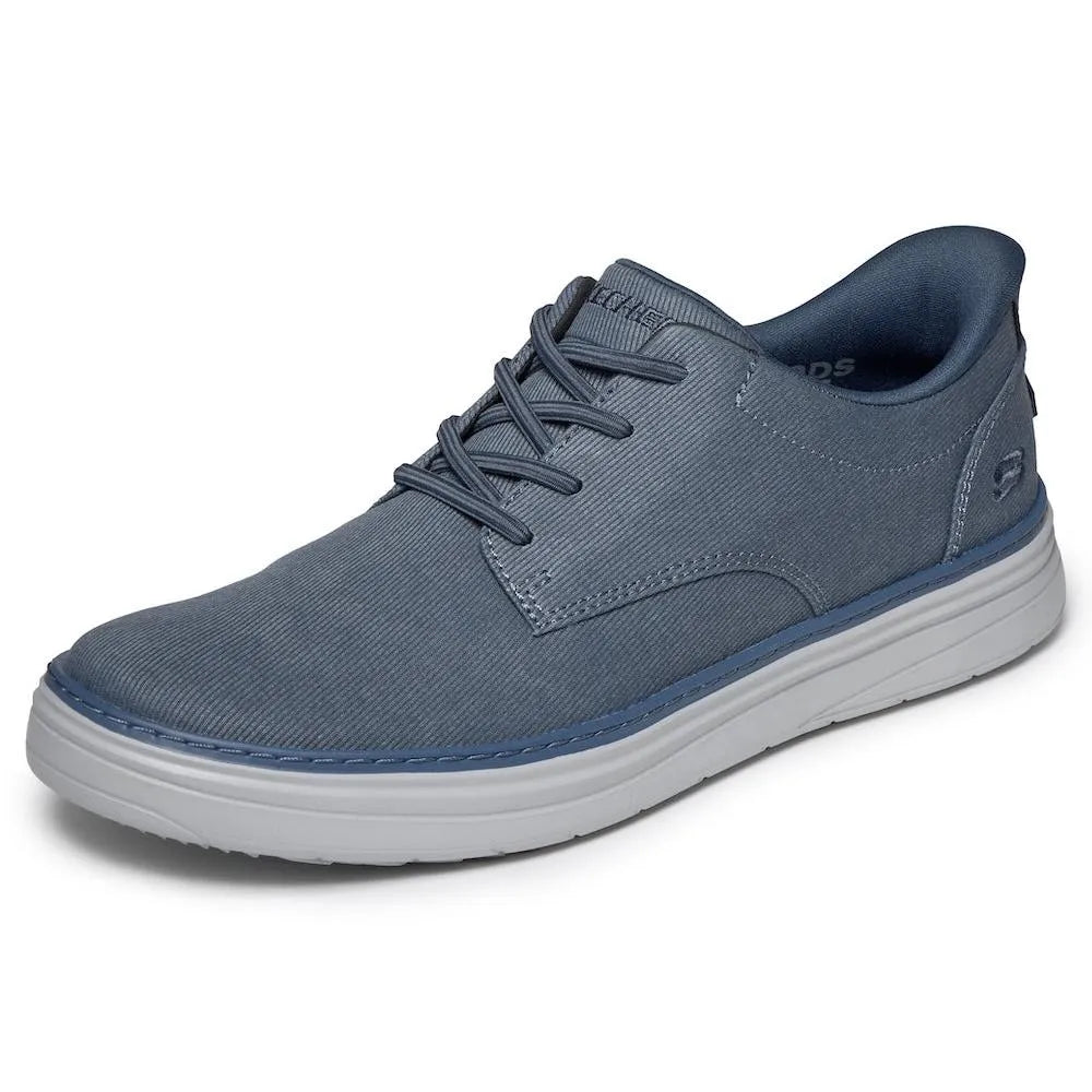 Skechers Hyland-Justino men's navy vegan slip-on trainers with lace-up design and cushioned white sole.