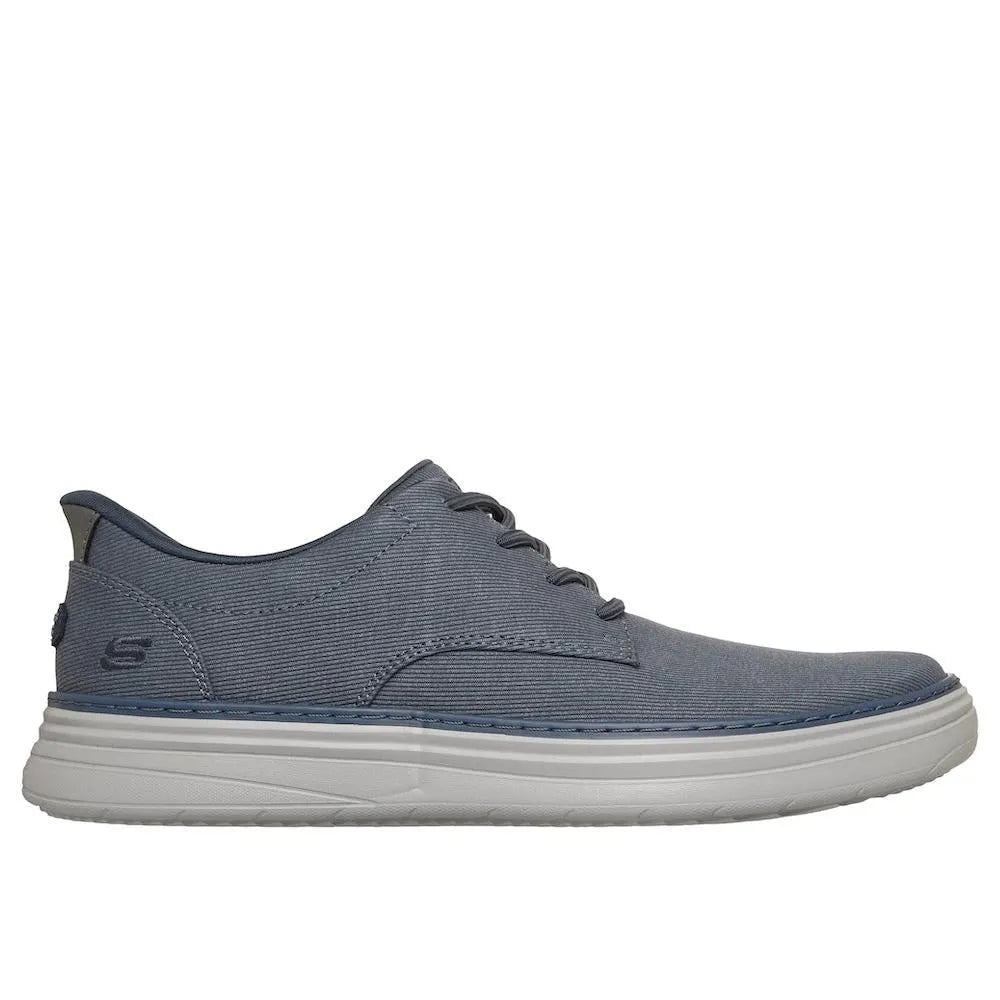 Skechers Hyland-Justino men's navy vegan slip-on trainers with breathable fabric upper and cushioned sole.