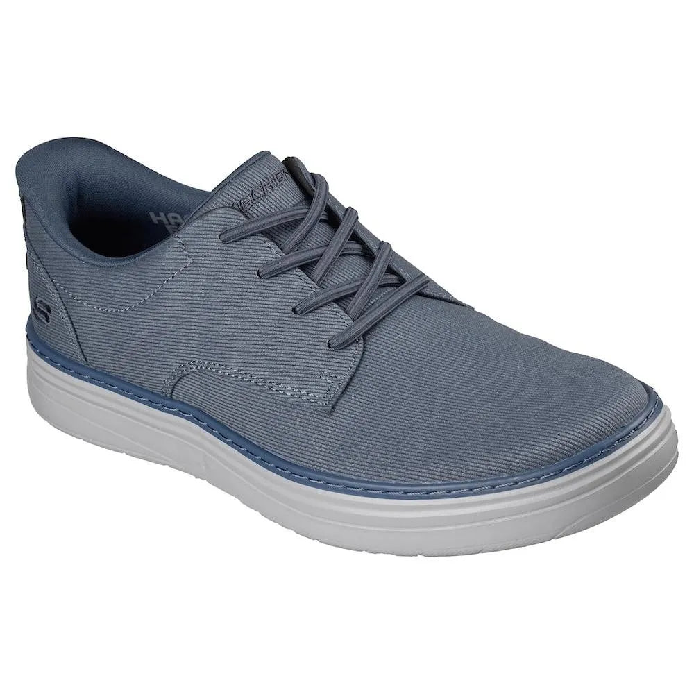 Skechers Hyland-Justino men's navy vegan slip-on trainers with lace-up design and white rubber sole.