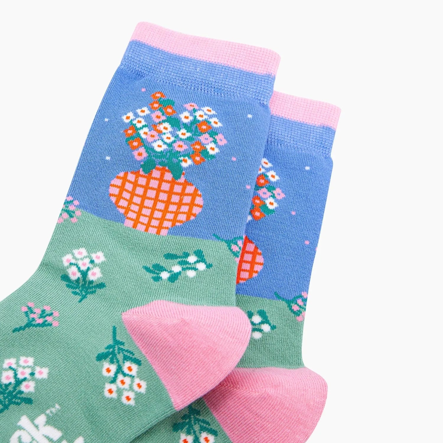 Sock Talk flower vase bamboo socks in blue and green with pink accents, featuring floral and vase patterns.
