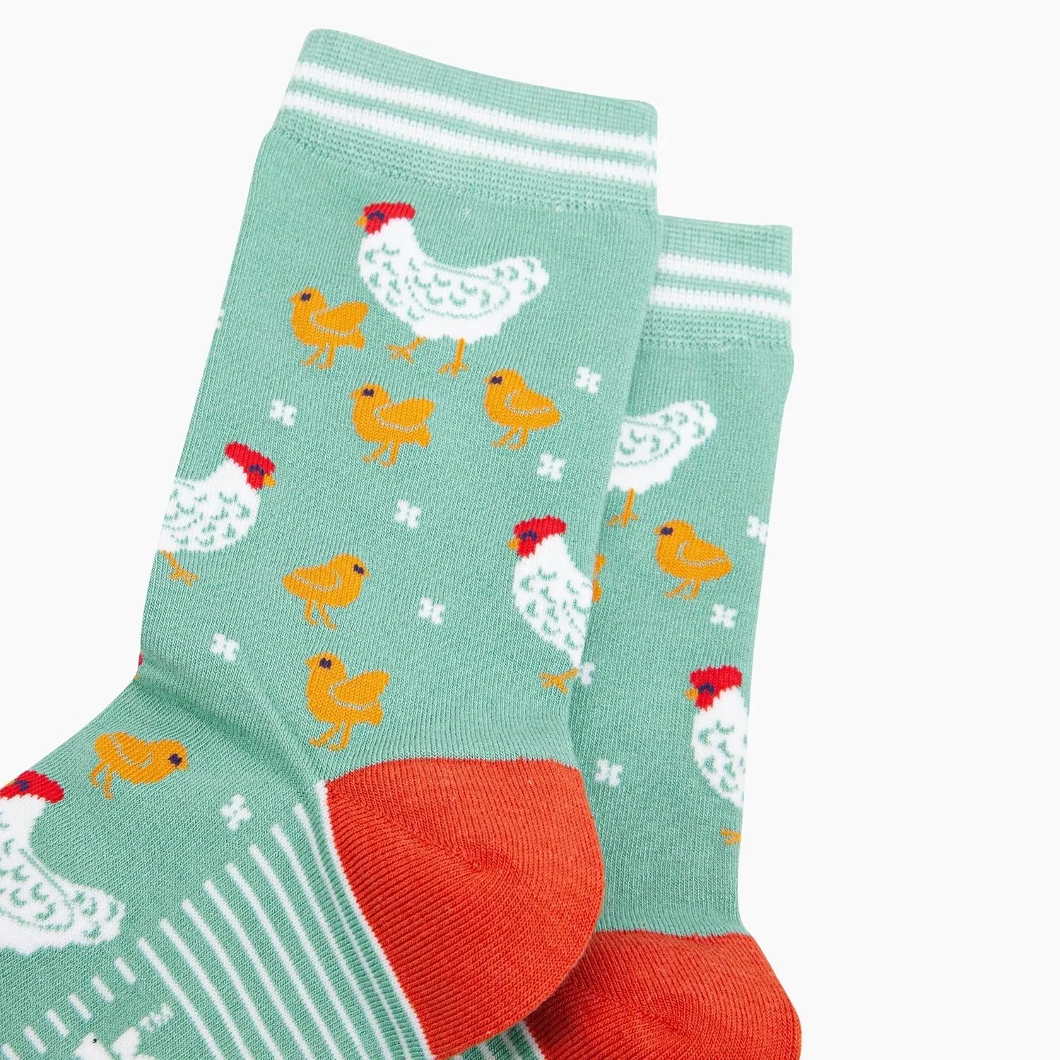 Sock Talk Hens and Chicks bamboo socks in green with chick and hen print, featuring white, red, and yellow accents.