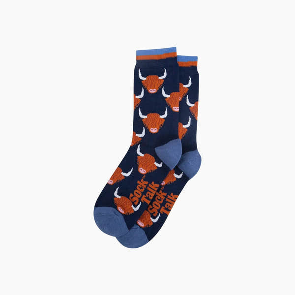 Sock Talk Highland Cow bamboo socks in navy blue with Highland cow pattern, featuring orange and white accents and blue toe and heel.