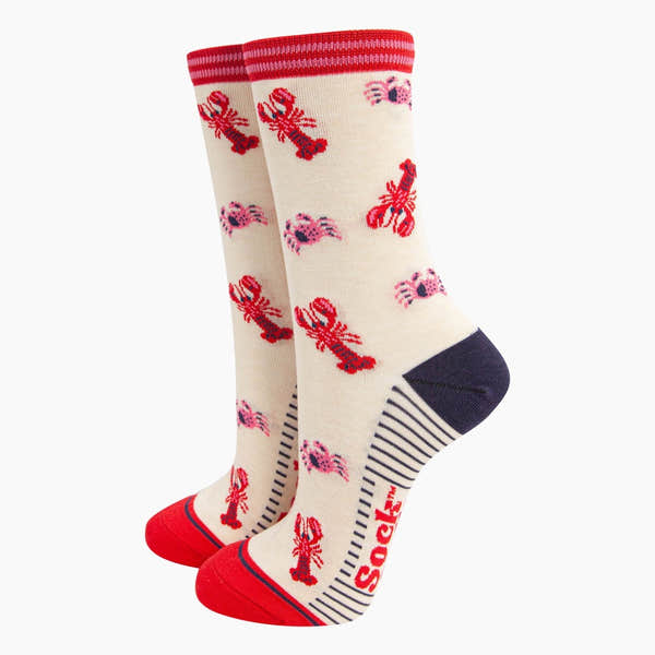 Sock Talk Ladies cream bamboo socks with red lobsters and crabs, pink shells, striped accents, and reinforced toes and heels.