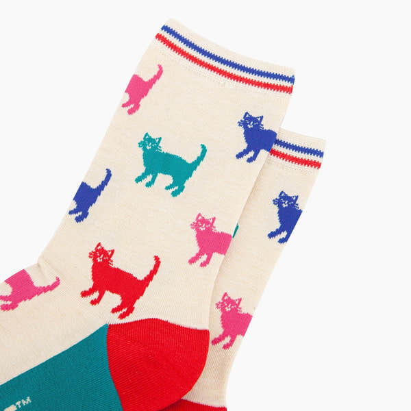 Sock Talk ladies cream/brown bamboo socks with colorful cat patterns, striped top, and red/blue accents.
