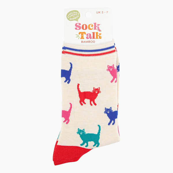 Ladies cream bamboo socks with colorful cat print, red toe, striped cuff, and stylish design.