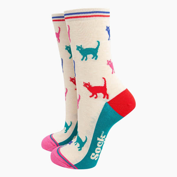 Sock Talk Ladies cream/multi cats bamboo socks with colorful cat pattern, red heel, turquoise toe, and striped band at top.