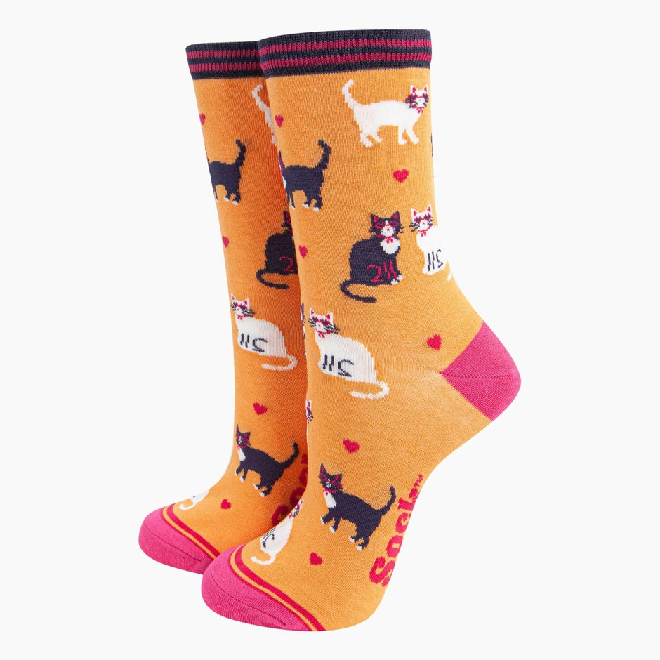 Sock Talk Ladies orange cats and love hearts bamboo socks with playful cat and heart pattern, featuring pink accents and stretchy cuffs.