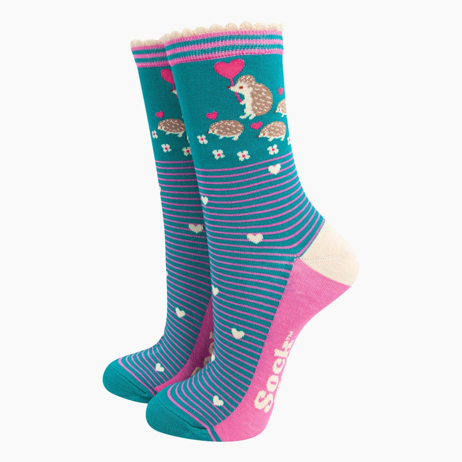 Sock Talk Ladies teal hedgehog and babies bamboo socks with hedgehog and heart patterns, pink accents, and striped design.