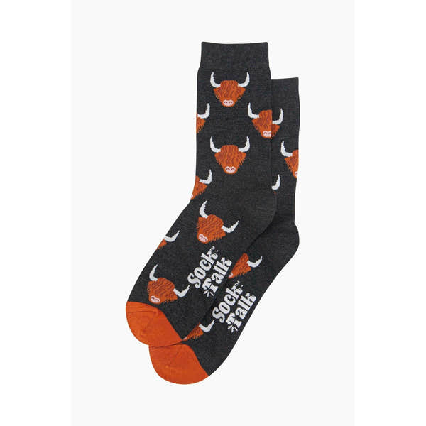 Men's black bamboo socks with Highland cow print and "Sock Talk" logo, featuring orange accents and cow face pattern.