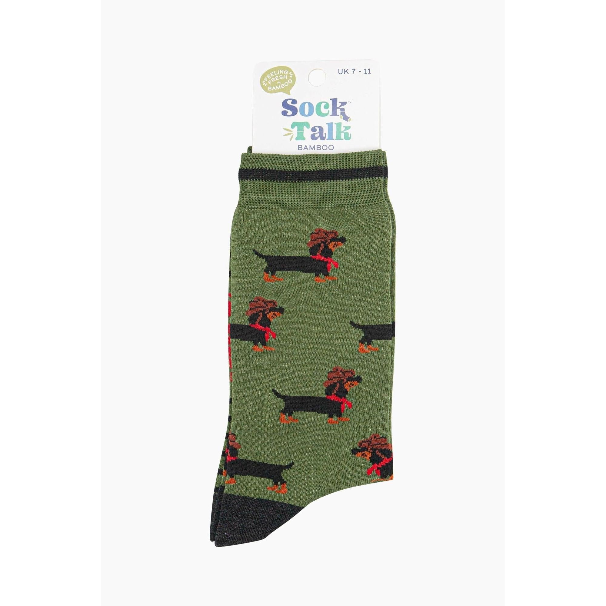 Green bamboo men's socks featuring a dachshund dog wearing a cowboy hat and red bandana pattern.